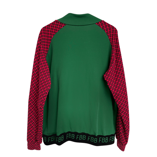 Green and red jacket with patterned sleeves on a hanger against a white background