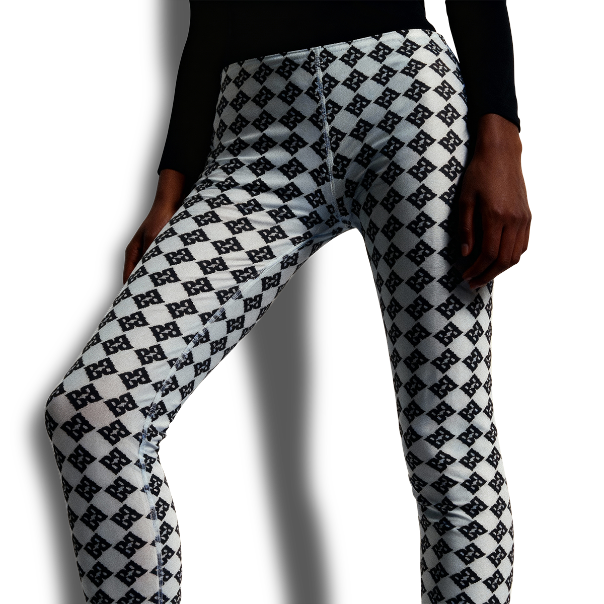 Model wearing FBB Lamb Grey Yoga Leggings with Black Lynx design during yoga session