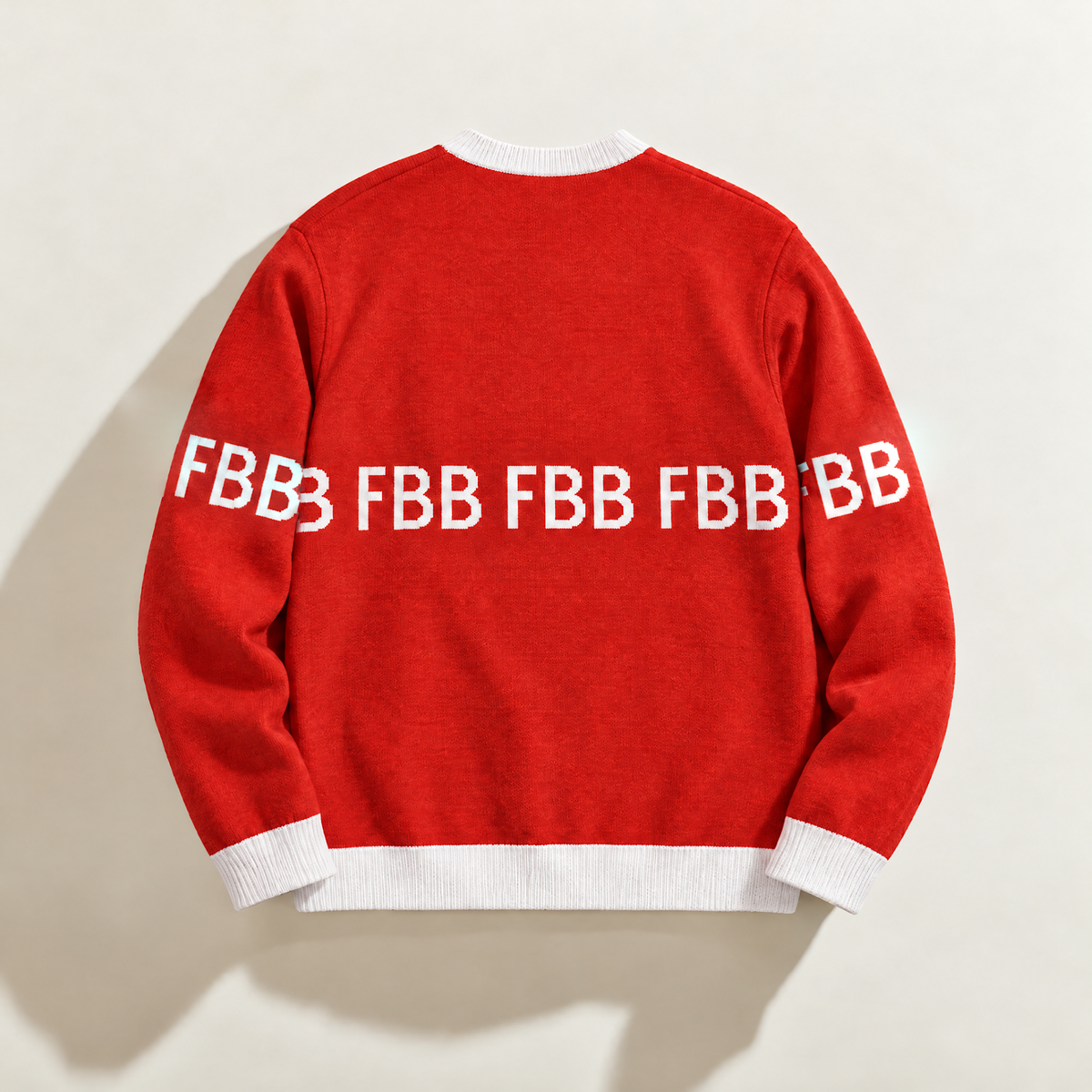 Back of FBB Legacy Red knit sweater with white trim and repeating white FBB lettering across the back and sleeves.

