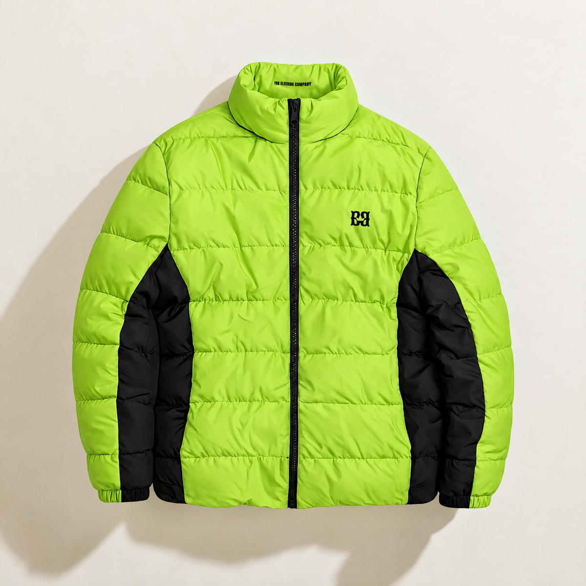 Front view of the lime FBB puffer jacket with black side panels, a black zipper and chest monogram.