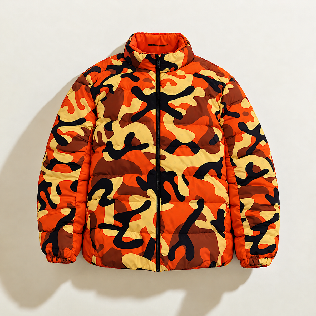 Front view of the FBB M3 Urban Camo puffer jacket in orange, brown, yellow and black with a black zipper.