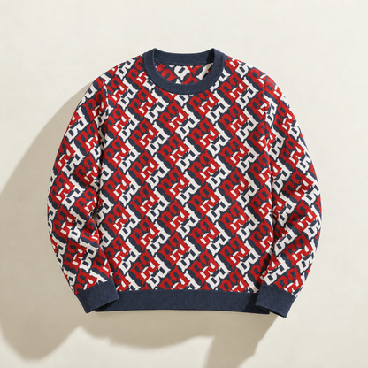 Front of FBB RWB Breaker knit sweater with a red, white and dark blue monogram pattern and dark blue ribbed trim.