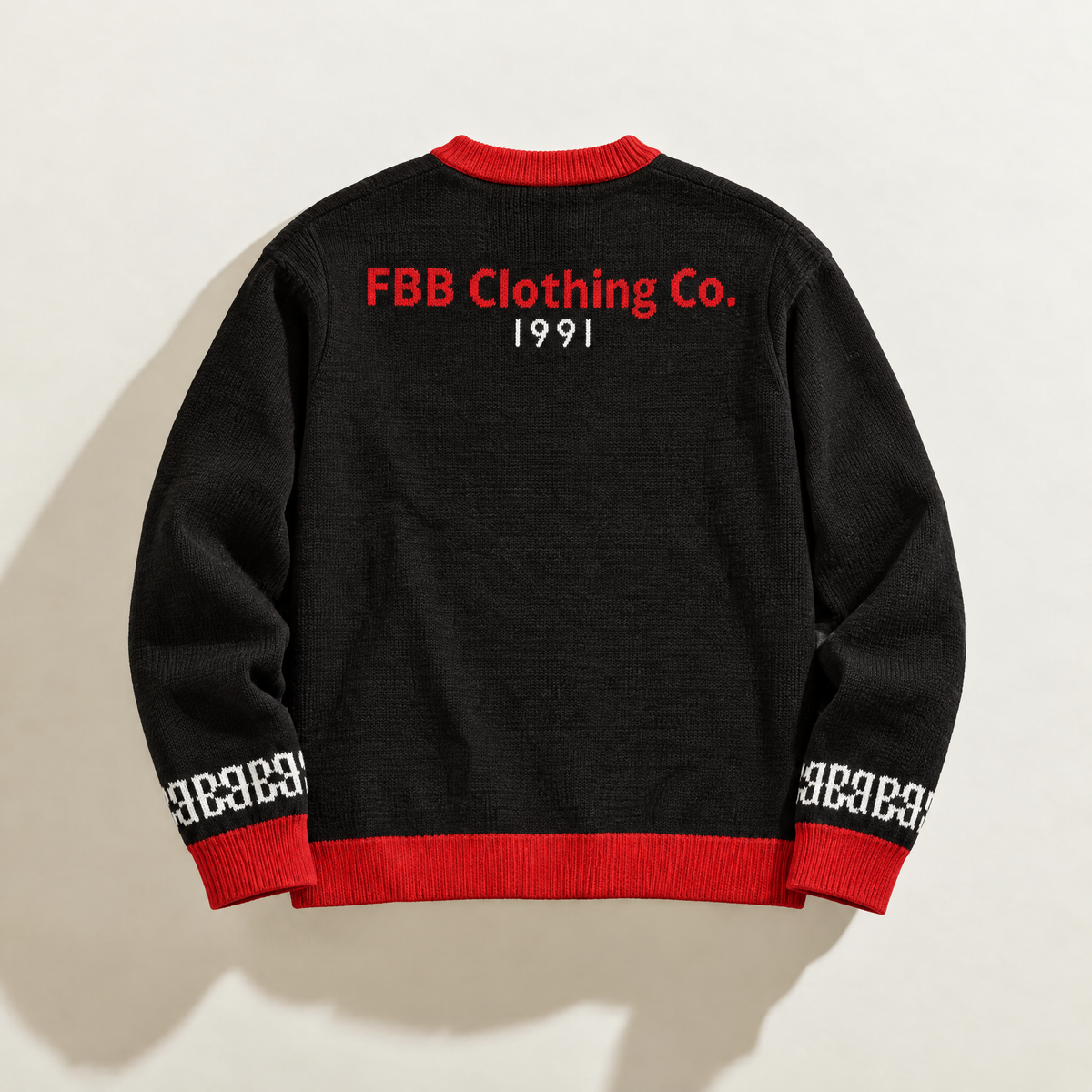 Back of FBB RBW black knit sweater with red trim, red FBB Clothing Co. lettering and white 1991 detail.
